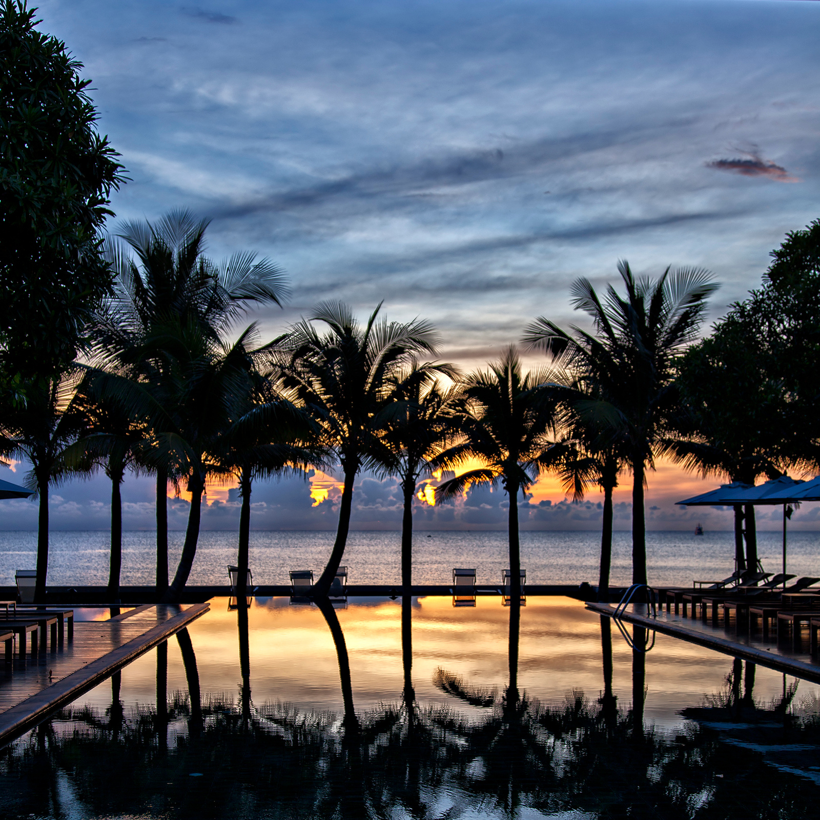 Luxury infinity pool at sunset